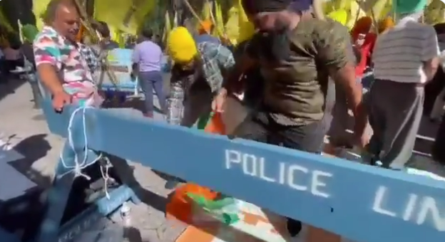 Farmers tearing the national flag