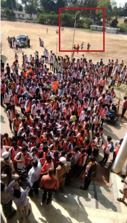 The flagpole was empty before the saffron flag was hoisted. 