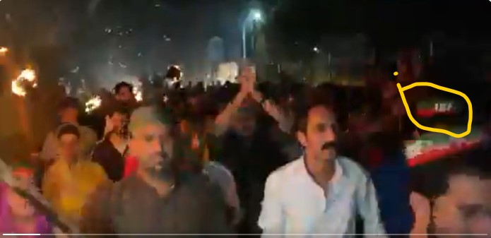 ISF written in the cap of participant of the rally